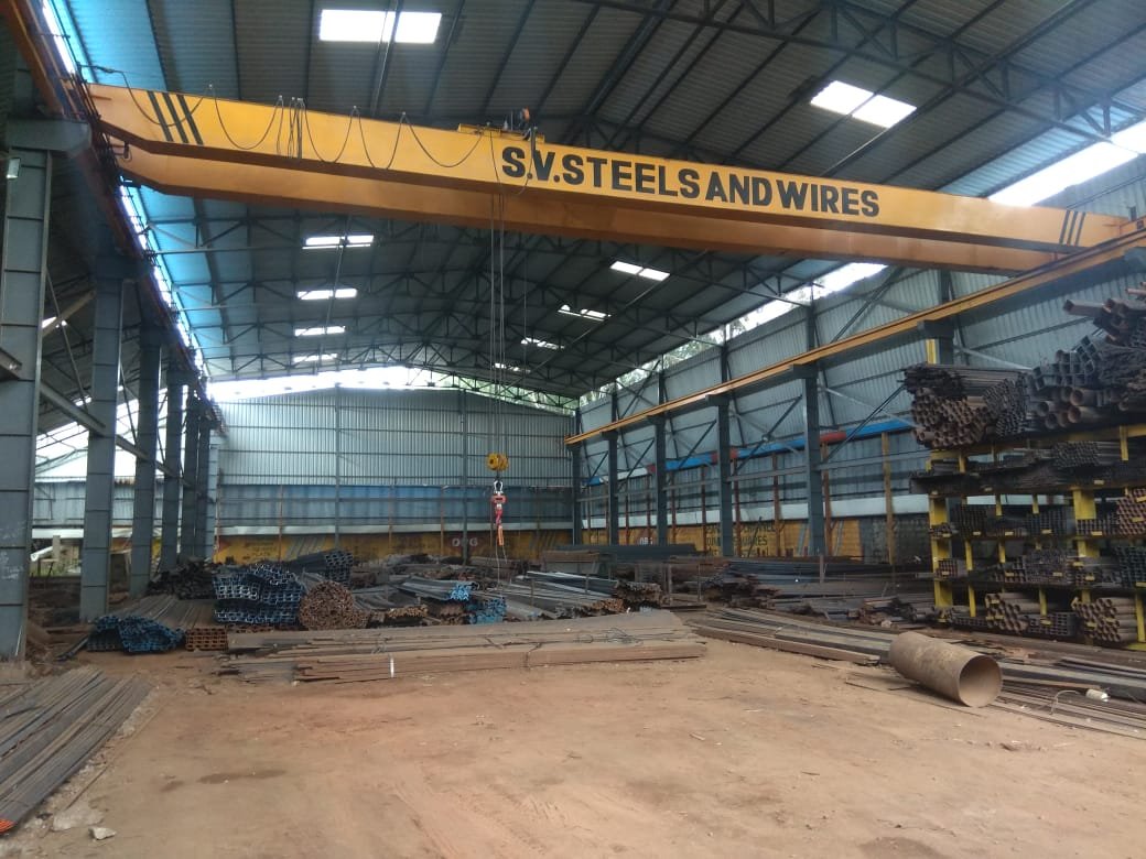 SV Steels indoor industrial stockyard equipped with overhead handling cranes